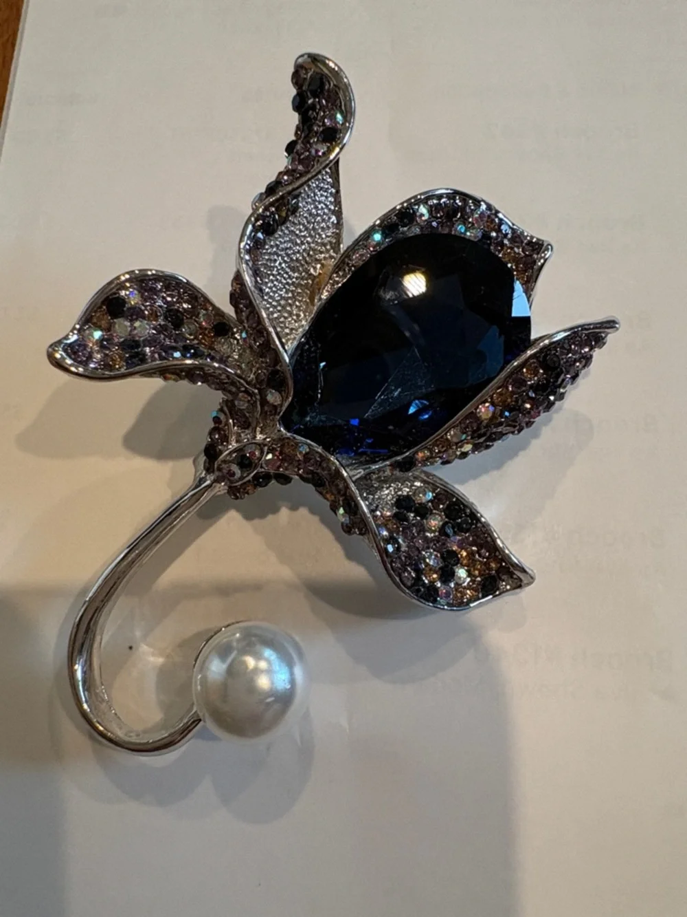 Crystal Flower Brooch with Dark Blue Stone and Pearl Accent
